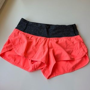 Pink Lulu Lemon athletic shorts.